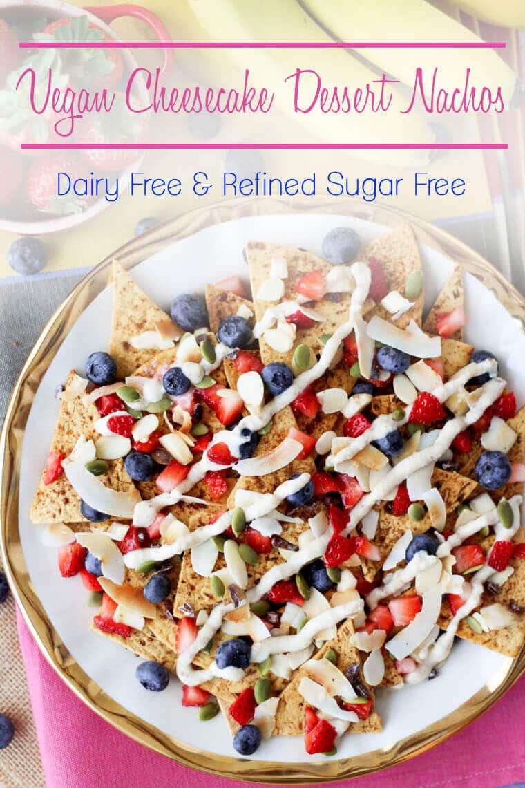 A plate of nachos with fruit on top with the text overlay \"Vegan Cheesecake Dessert Nachos. Dairy Free & Refined Sugar Free.\"