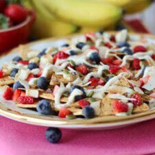 A close up of a plate of cheesecake flavoured nachos.