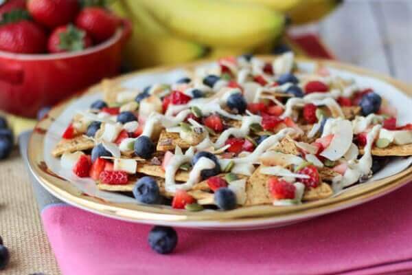 A close up of a plate of cheesecake flavoured nachos.