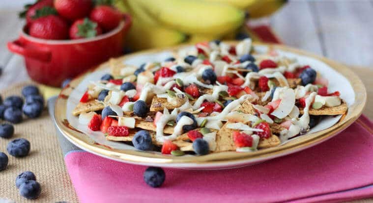 A close up of a plate of cheesecake flavoured nachos.