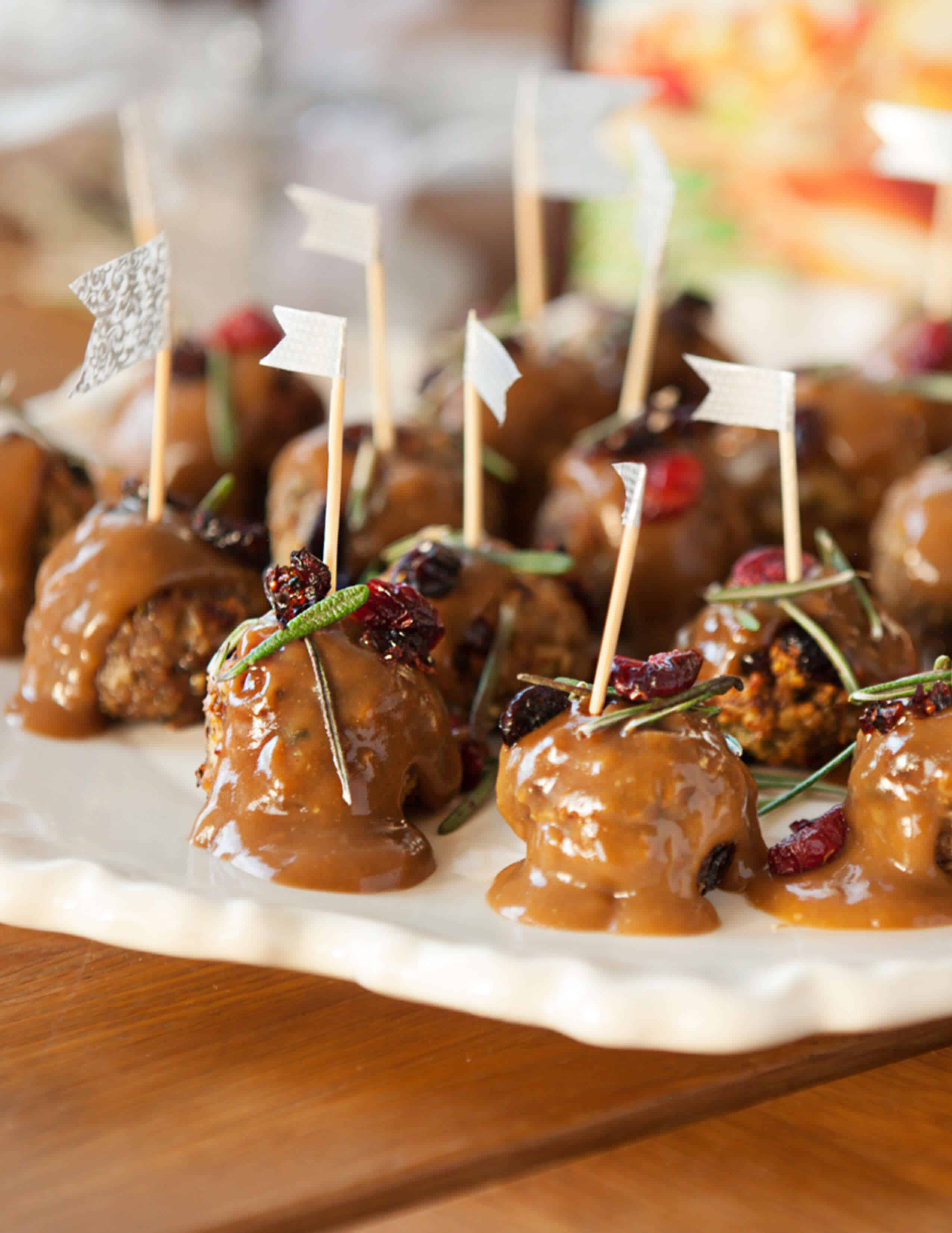 Cranberry turkey meatballs on a white serving dish 