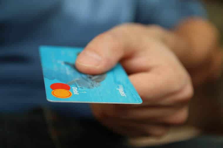 person holding a bank card