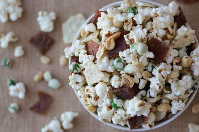 An overhead photo of popcorn and jerky snacks.