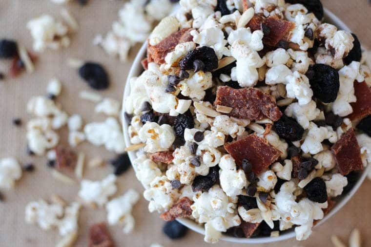 An overhead photo of a bowl of protein healthy party mix.