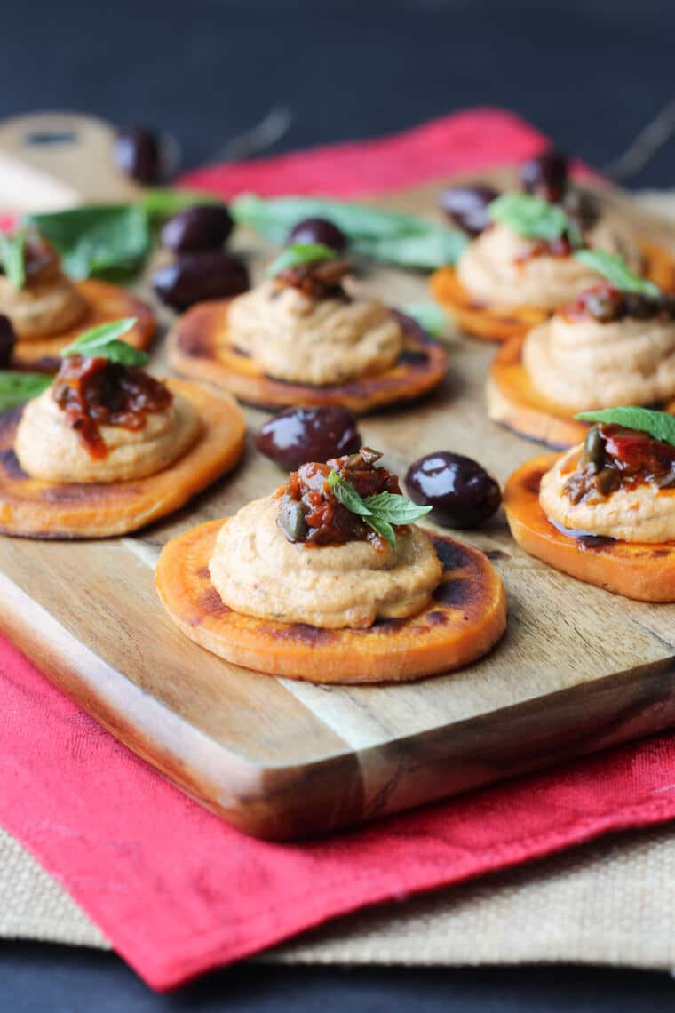 Multiple gluten free sundried tomato sweet potato bites.