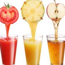 Glasses of juices with the fruit on top.