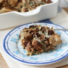 A plate of food on a table, with Sausage and Strata