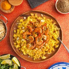 This healthy gluten free shrimp Biryani recipe starts with a flavorful Indian Shrimp marinade and is served peel and eat style. It's so good, you won't want to stop licking your fingers.