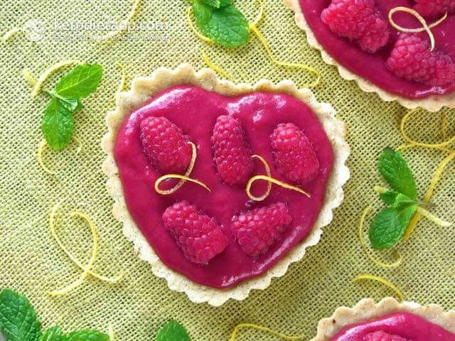 A raspberry curd heart shaped dessert.