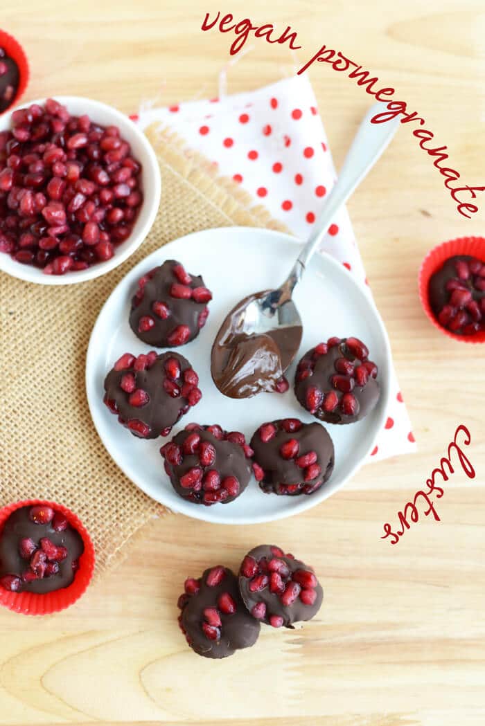 A plate of multiple pomegranate clusters. 