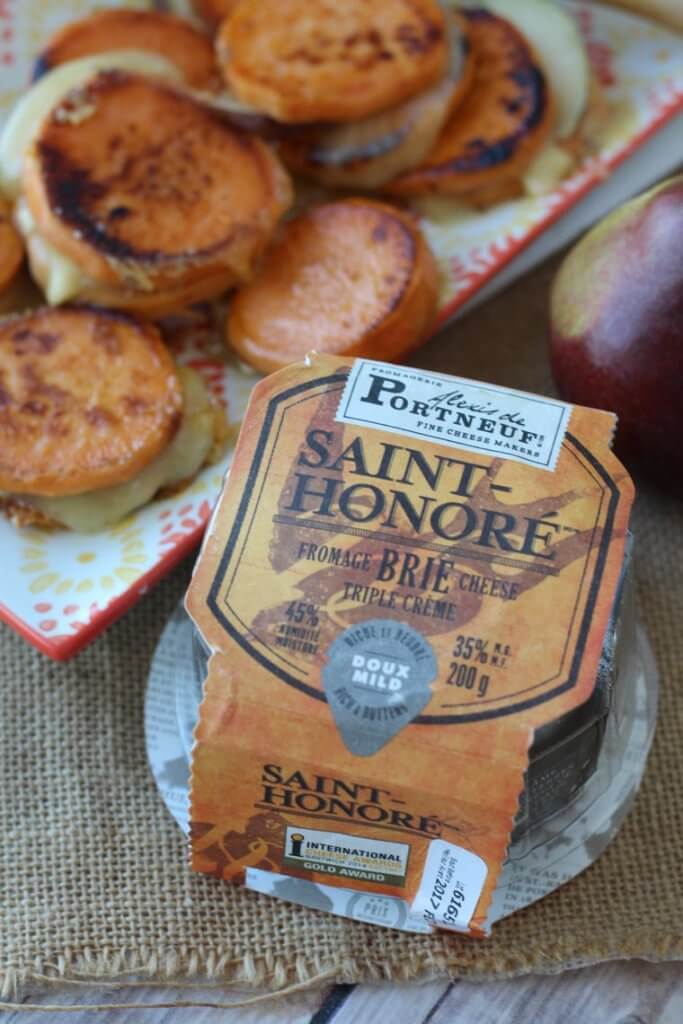 A packaged cheese and a pile of sweet potato grilled cheese sandwich on a plate in the background.