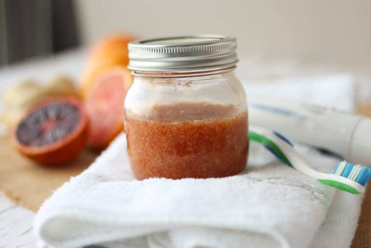 A mason jar with citrus body scrub.