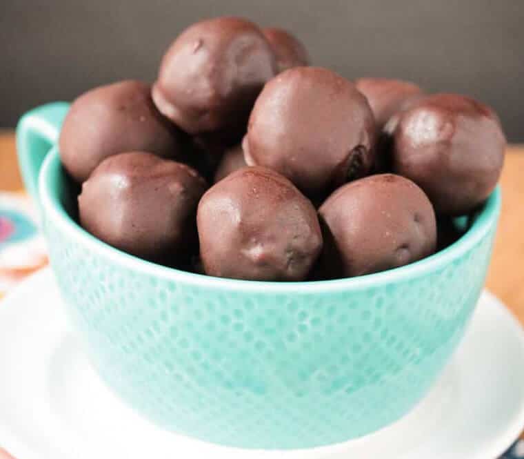 A bowl of cherry chocolate walnut truffles.