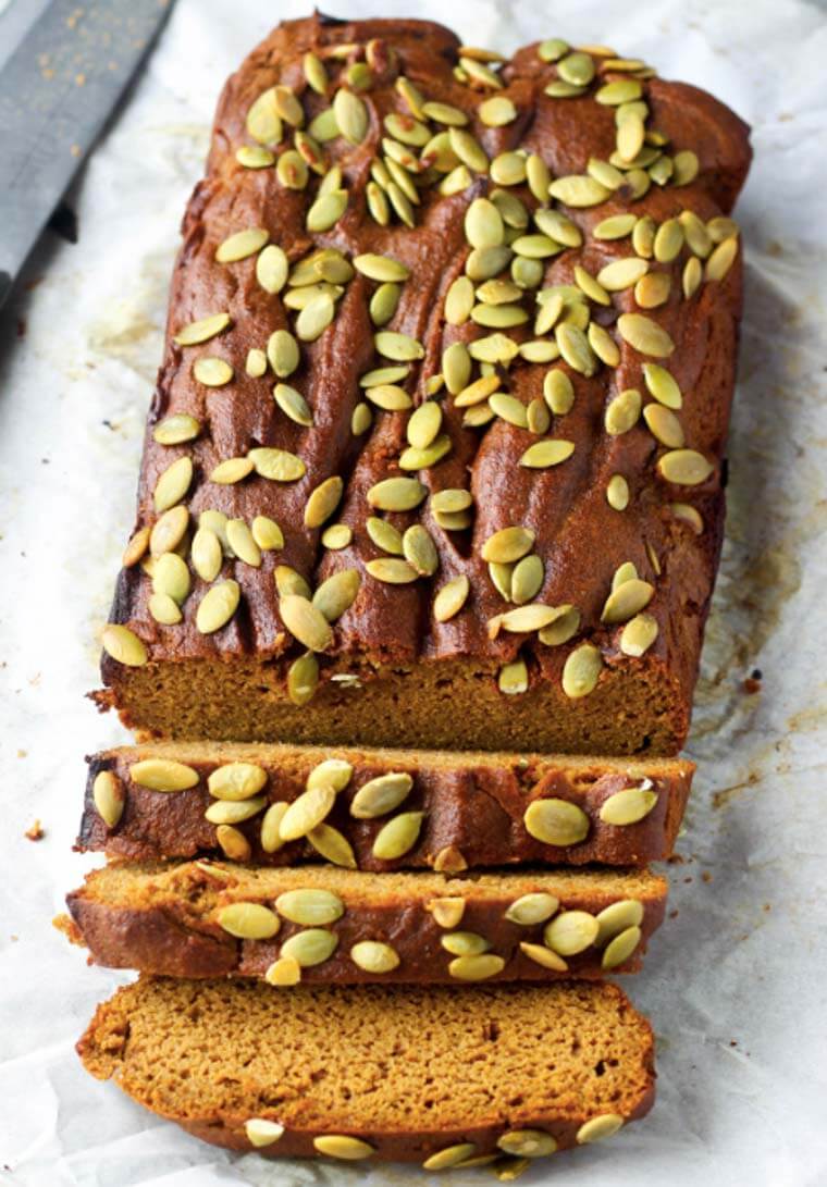 A loaf of flourless pumpkin bread, sliced.