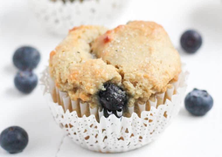 A close up of a gluten free blueberry muffin.