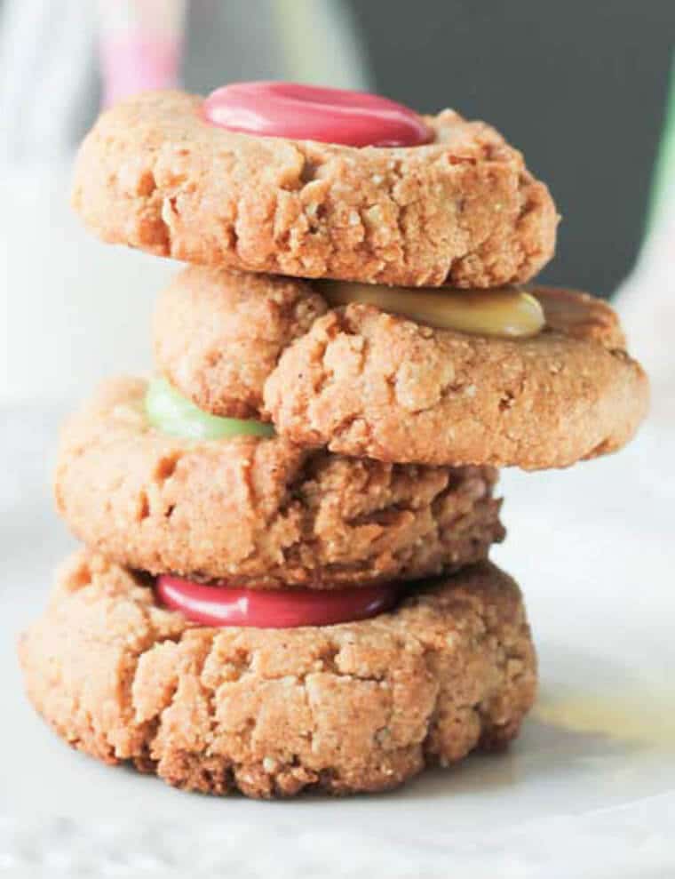 A stack of gluten free thumbprint cookie.