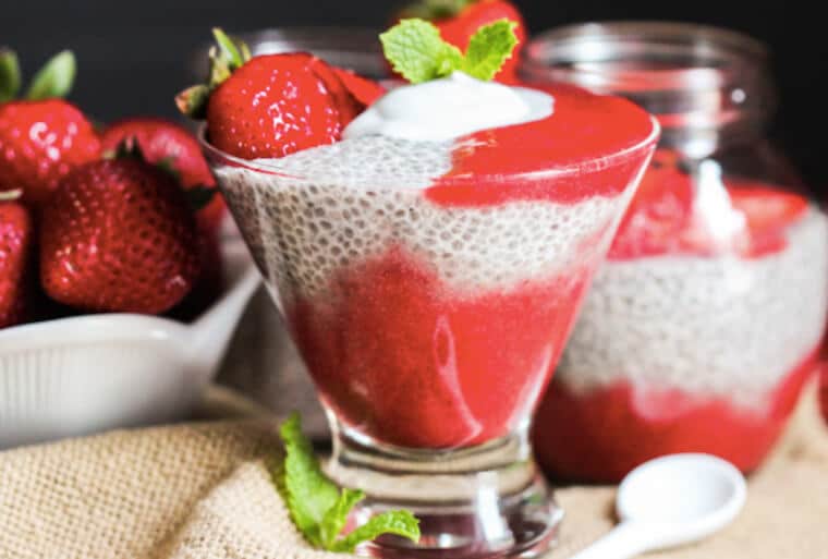 A glass cup of strawberry vanilla chia seed pudding.
