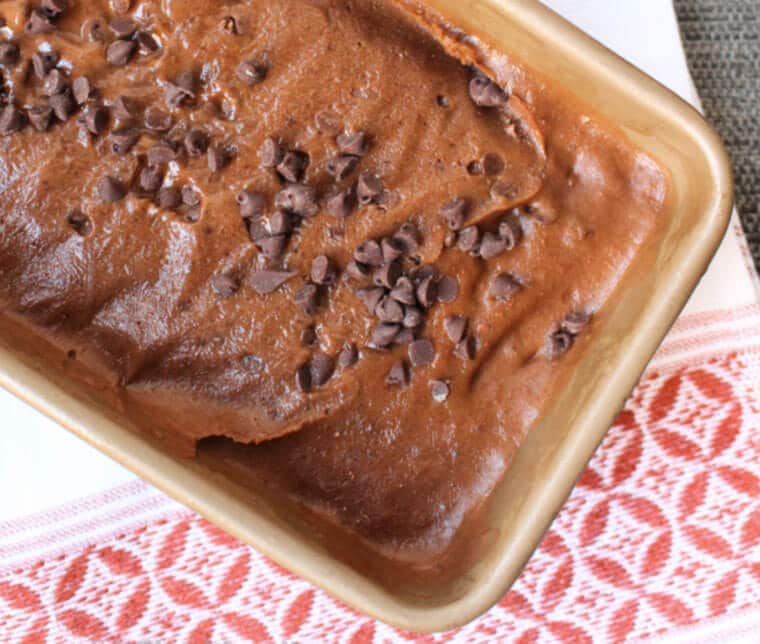 A close up photo of a loaf pan with no churn salted chocolate chip banana ice cream.