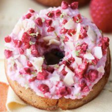 A close up of a raspberry margarita gluten free donut.