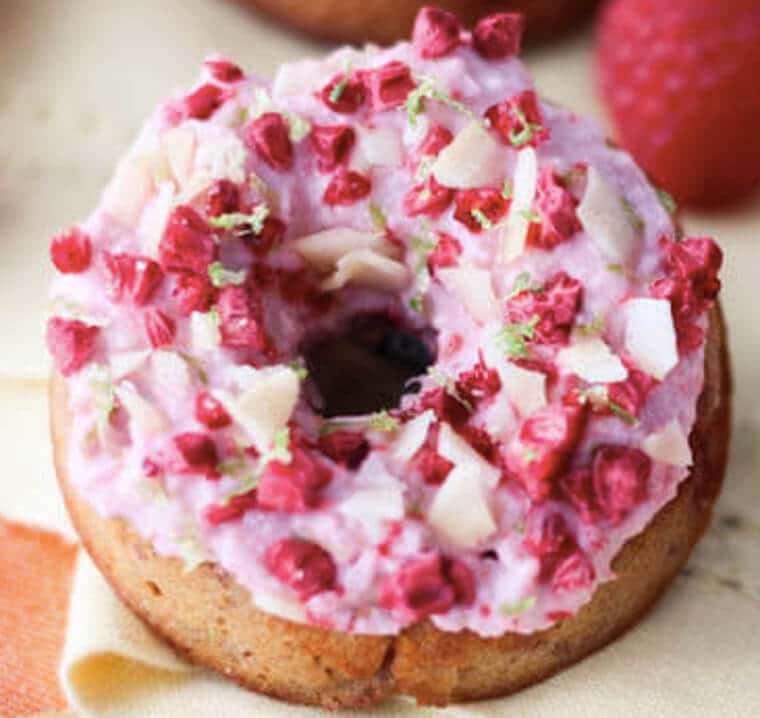 A close up of a raspberry margarita gluten free donut.