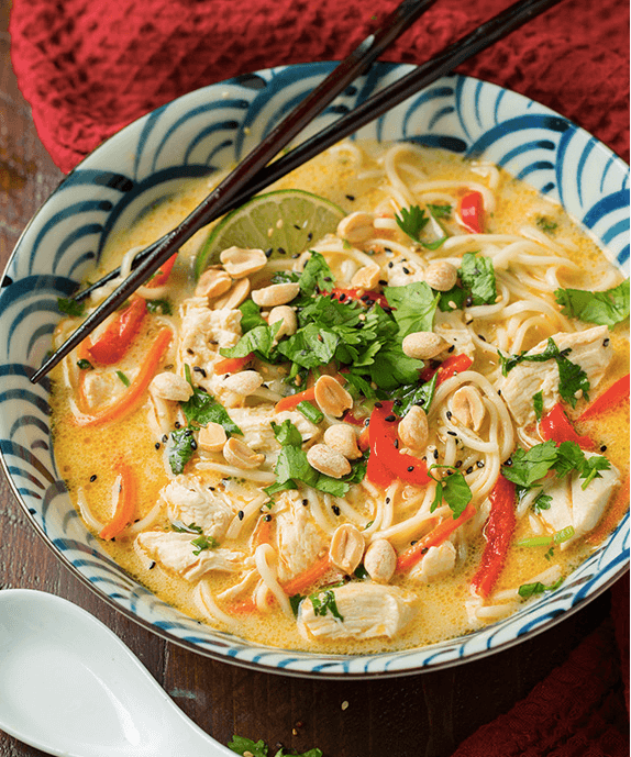 A bowl of thai chicken ramen.