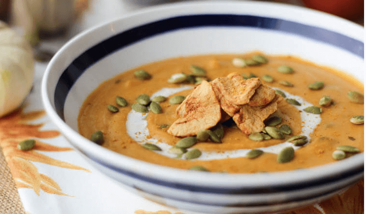 A bowl of curried sweet potato soup.
