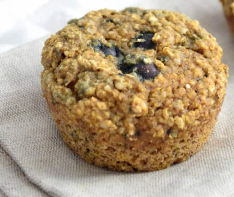 A close up of a blueberry quinoa muffin.