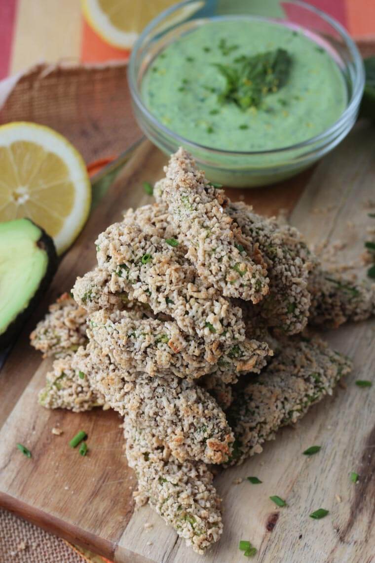 A serving platter with a stack of avocado fries.