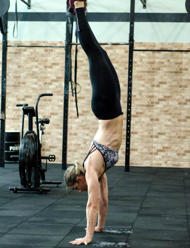 A person doing a handstand.