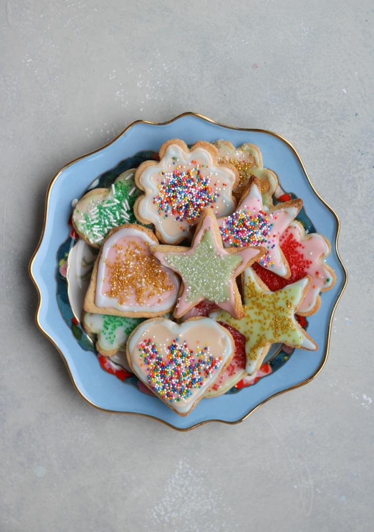 An overhead photo of a plate of multiple sugar cookies.