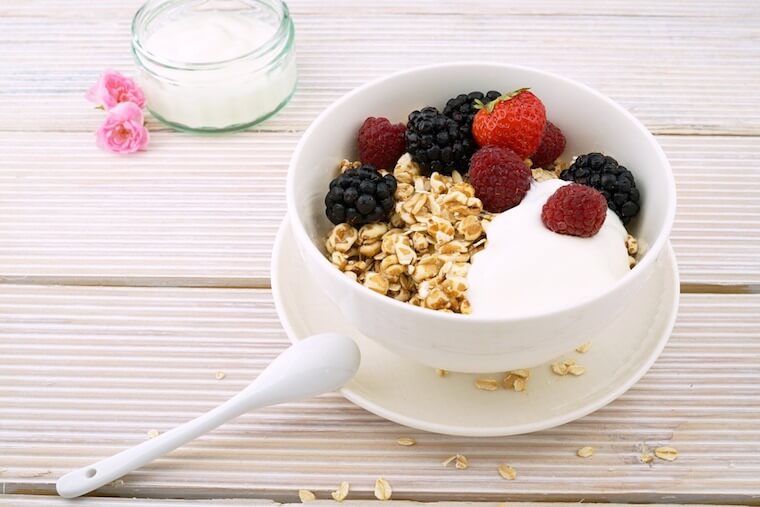 Image of a bowl of yogurt with granola and fruit.