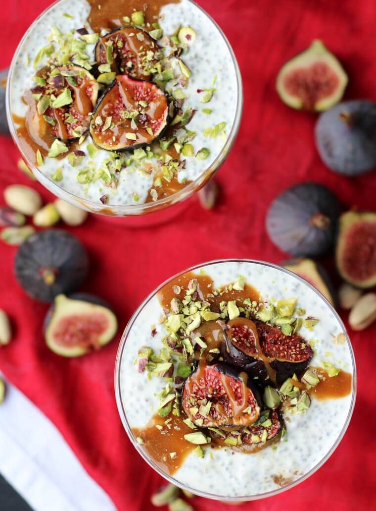 An overhead photo of two roasted fig chia pudding with tahini date caramel on top.