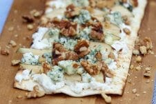 A tasty pear and blue cheese grilled pizza with ricotta, walnuts and thyme.