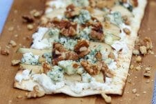 A tasty pear and blue cheese grilled pizza with ricotta, walnuts and thyme.