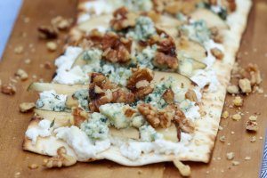 A tasty pear and blue cheese grilled pizza with ricotta, walnuts and thyme.