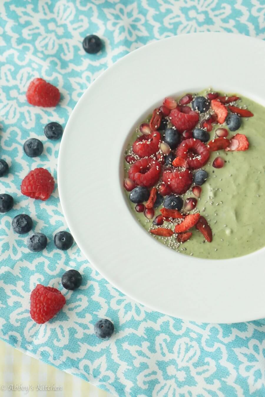 A smoothie bowl with fruit on top.