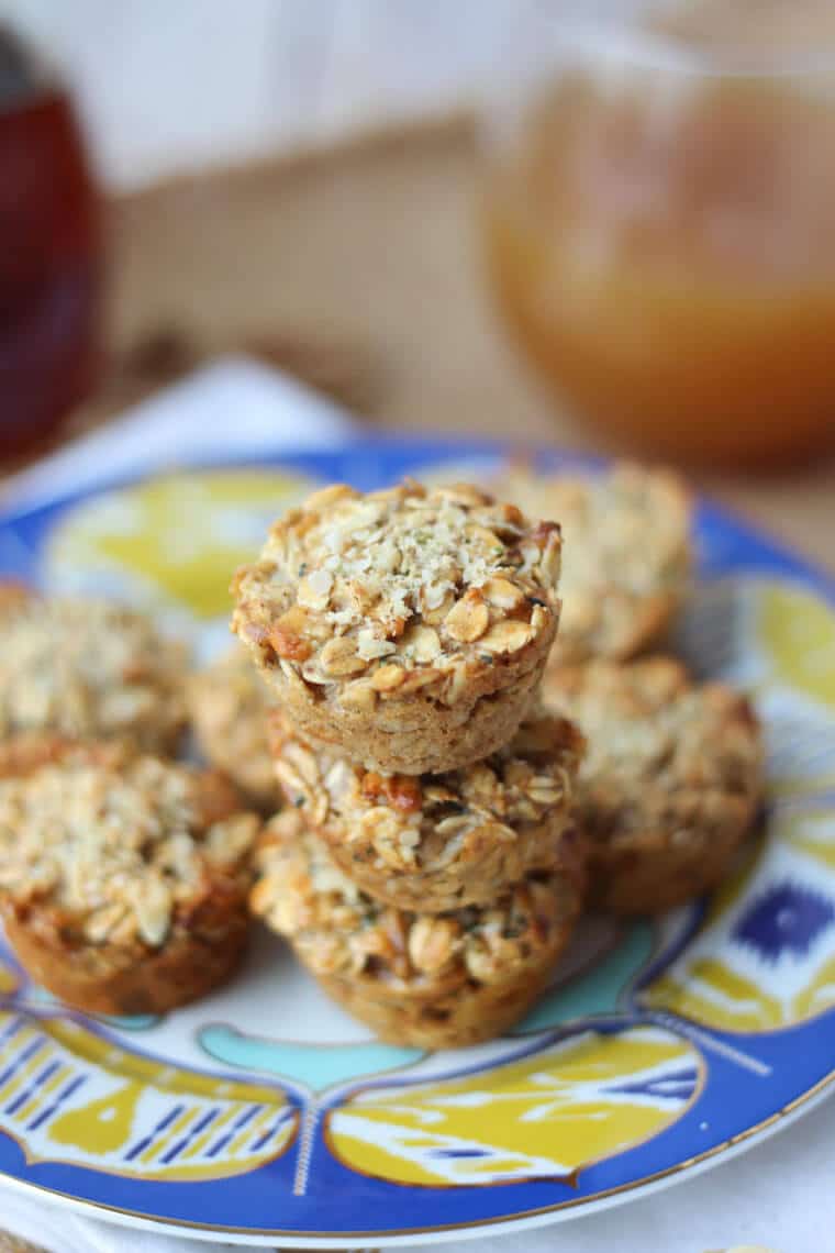 A pile of apple pie granola cups on a blue and yellow plate.