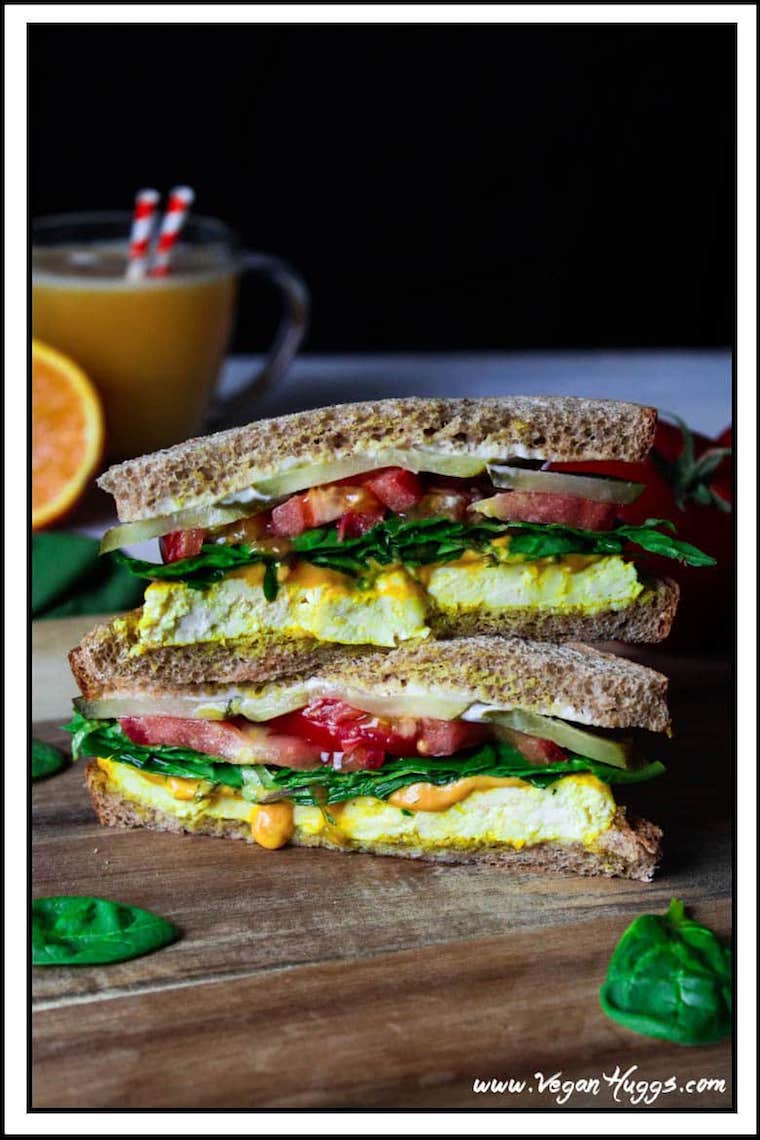 Vegan sandwich on wooden board.