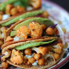 These vegan buffalo cauliflower and chickpea hard tacos are loaded with spicy buffalo flavour in buffalo-glazed hard tacos. 