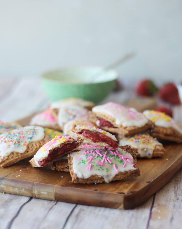 Homemade poptarts on a wooden board.