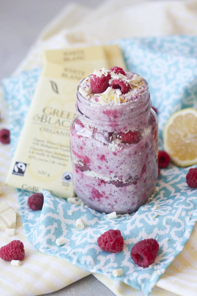 A mason jar containing white chocolate, lemon, raspberry overnight oats.