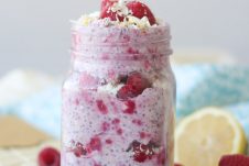 A mason jar containing white chocolate, lemon, raspberry overnight oats.