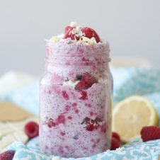 A mason jar containing white chocolate, lemon, raspberry overnight oats.