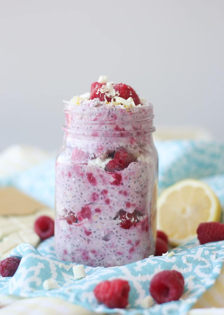 A mason jar containing white chocolate, lemon, raspberry overnight oats.