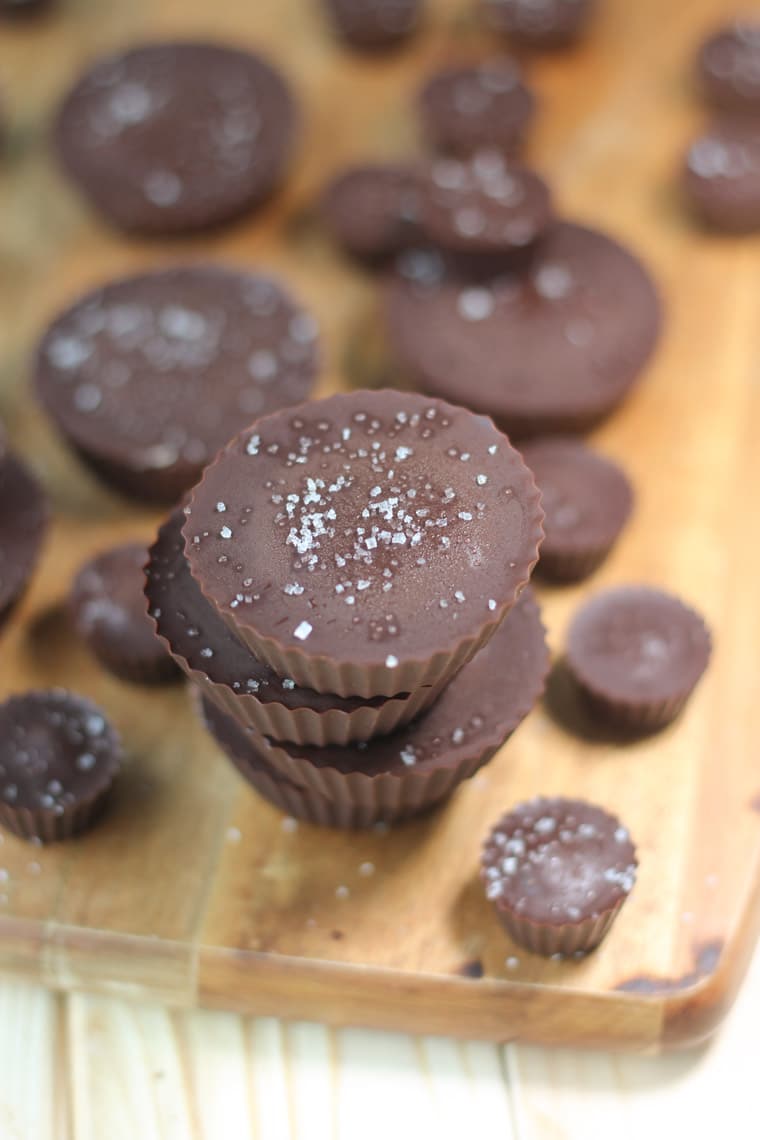 birds eye view of vegan chocolate caramel cups with no added sugar topped with flaky salt