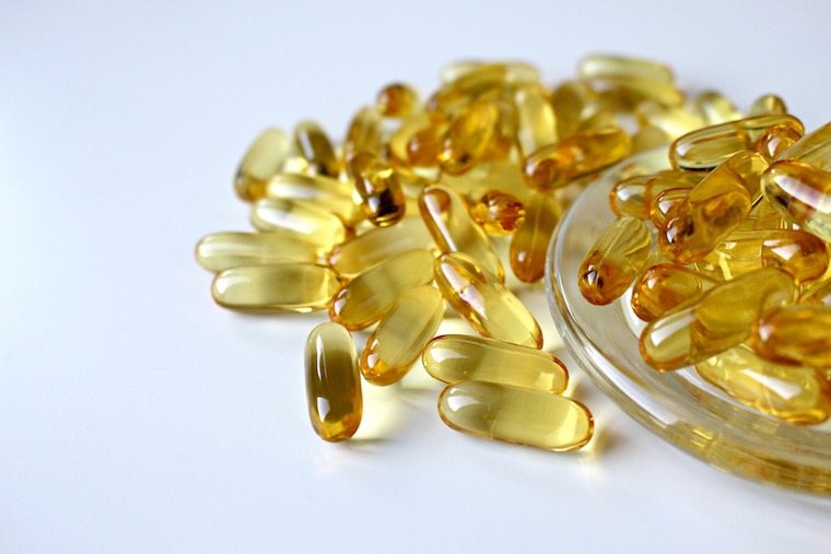 A close up of fish oil pills.