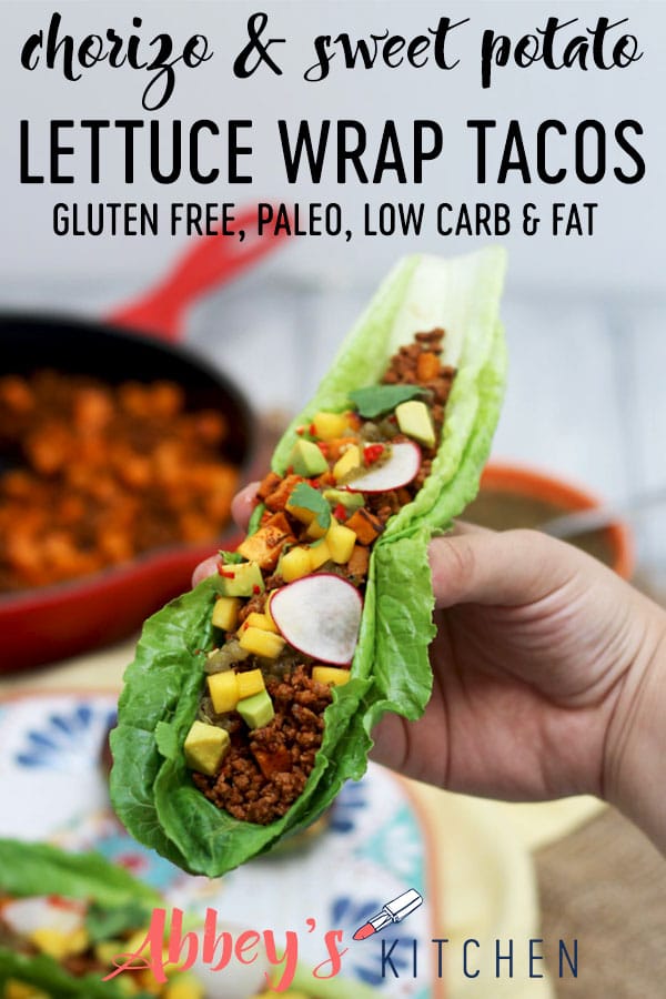 pinterest image of a hand holding low fat gluten free paleo chorizo and sweet potato taco with text overlay