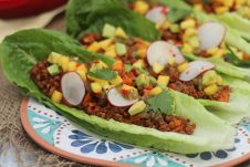 These low fat homemade chorizo and sweet potato tacos are packed with flavour, served in low carb lettuce wraps, and topped with avocado, mango and radishes.