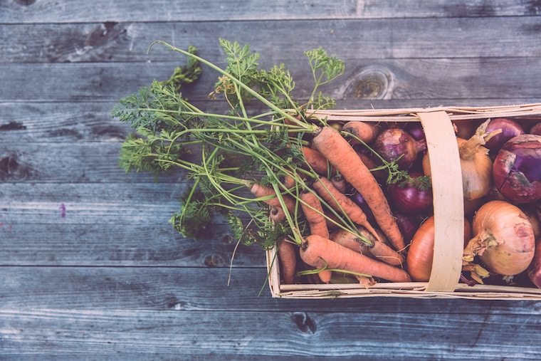 birds eye view of carrots in a basket