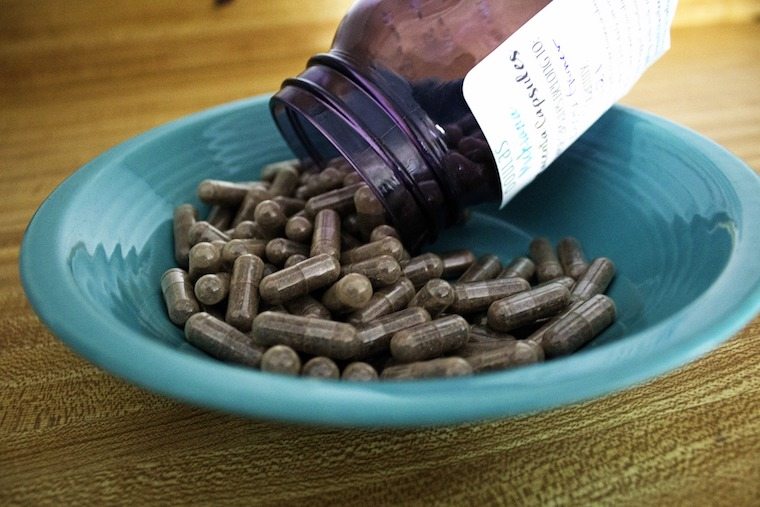 Pills poured into a bowl.